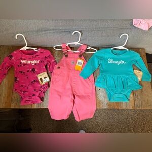 Size 3 month carhett overalls 
Size 3-6 wrangler long sleeve onesies